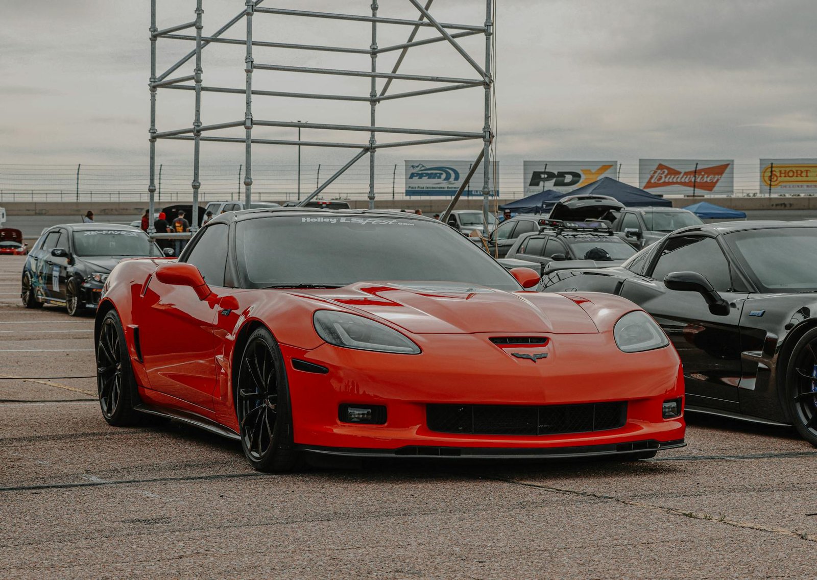 parked red corvette on a pavement